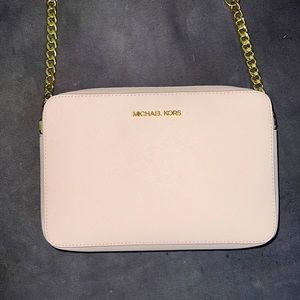 Michael Kors Crossbody leather purse in baby pink with gold embellishments